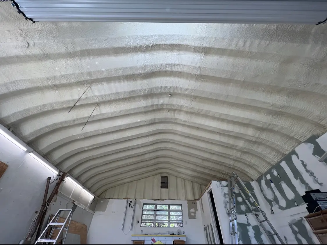 Spray polyurethane foam applied to the underside of a metal roof deck in Cheyenne